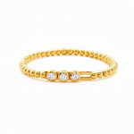 yellow gold Hulchi Belluni stretch bracelet with three diamonds