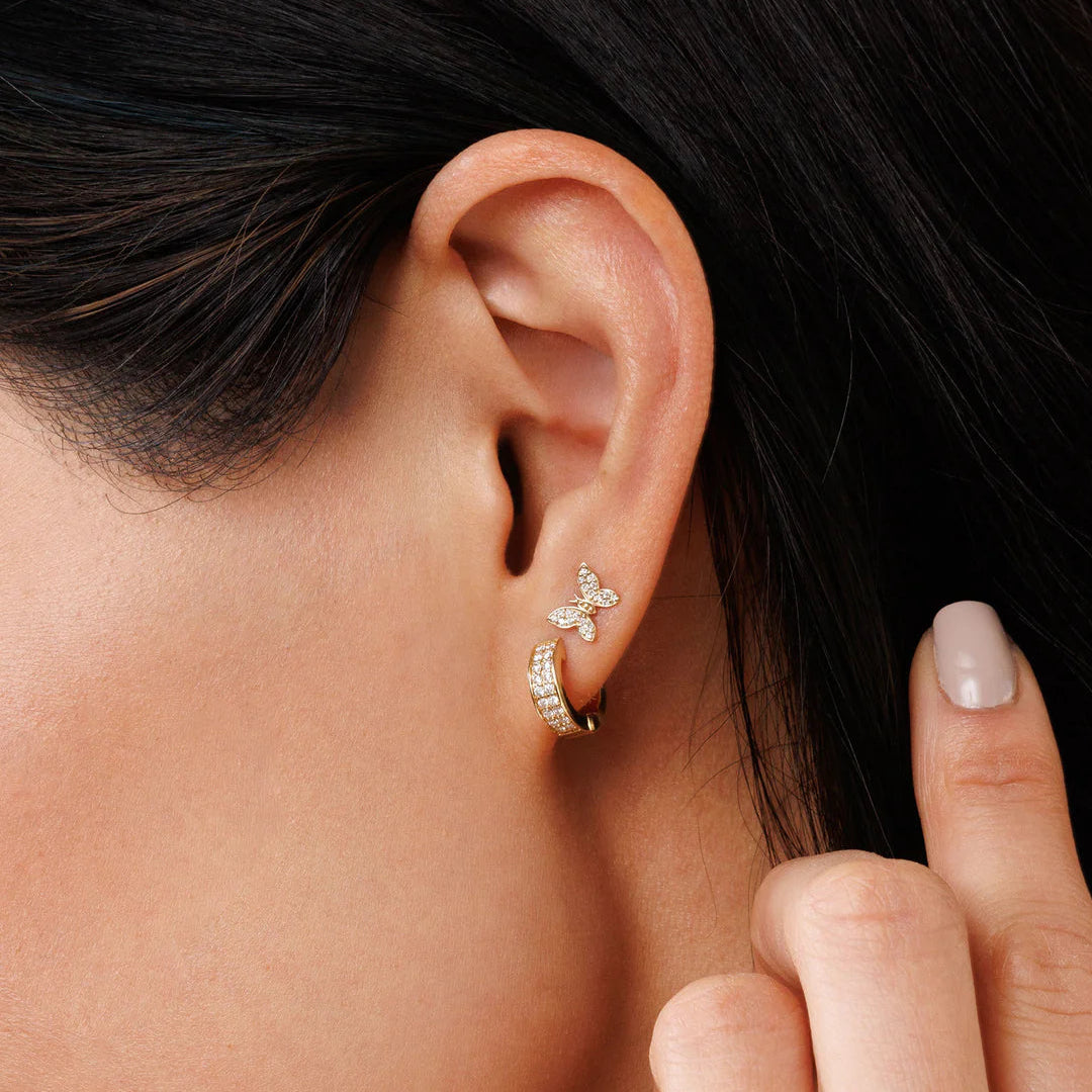 Tiny diamond butterfly stud in yellow gold 