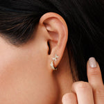 Tiny diamond butterfly stud in yellow gold 